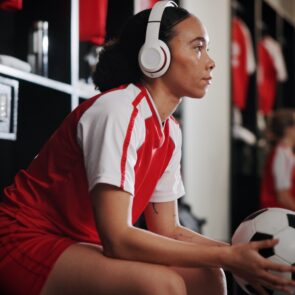 soccer player listening to headphones